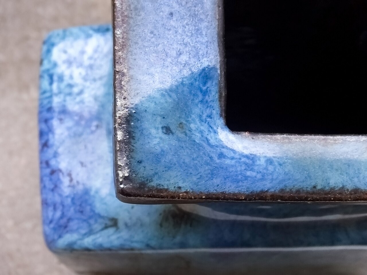 A hand-thrown ceramic vase on the workbench
